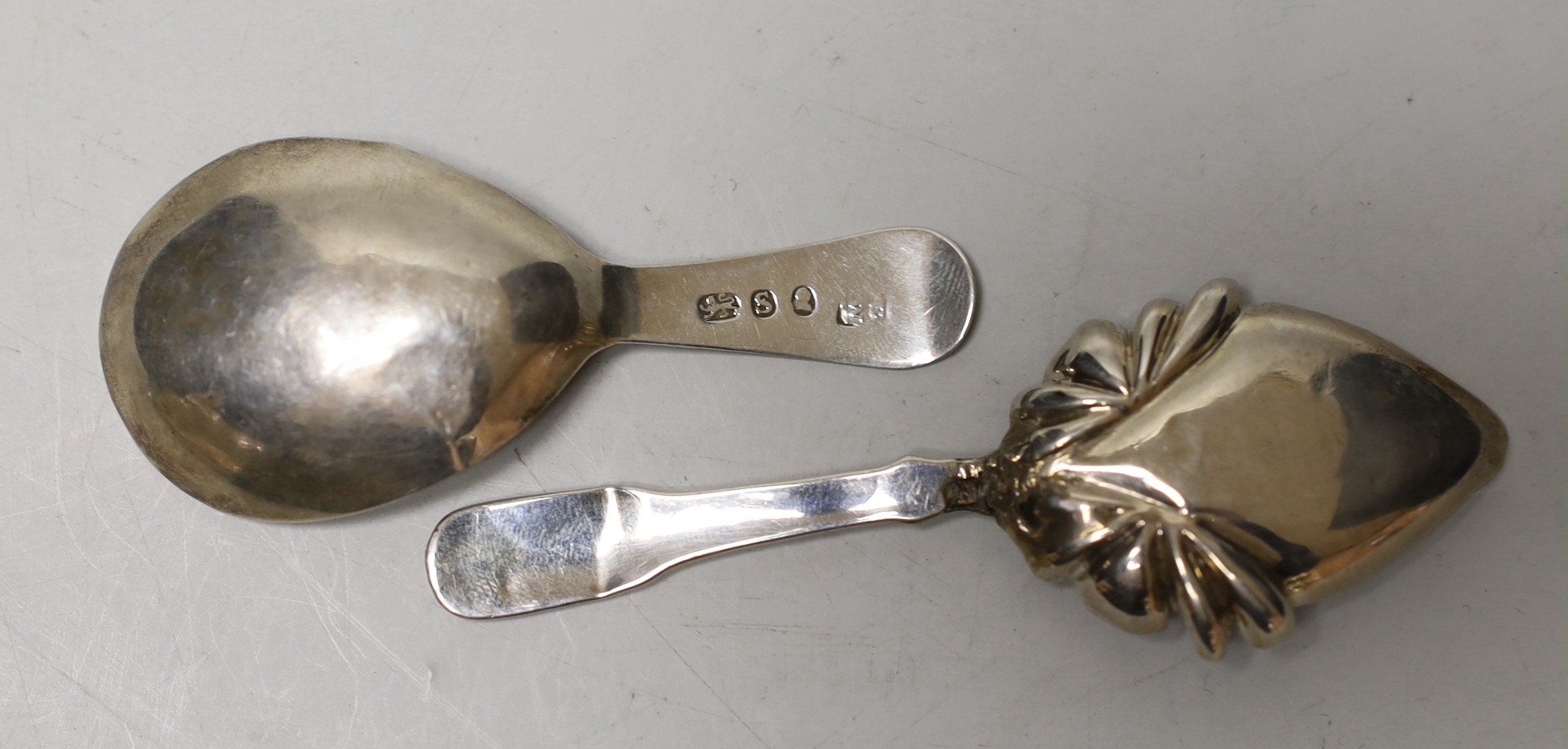 Two 19th century silver caddy spoons, both a.f.